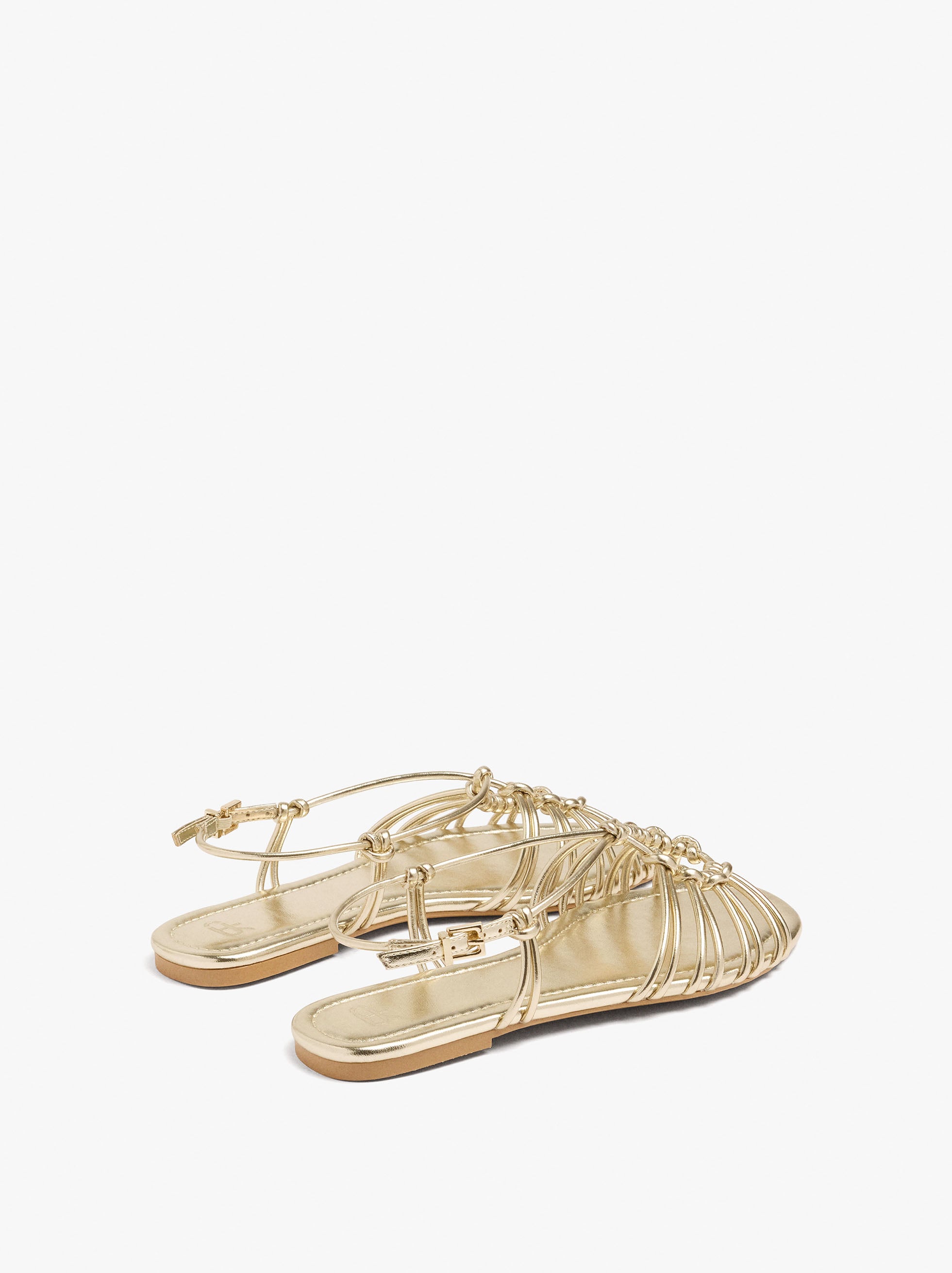 Sandalias Planas Metalizadas Con Nudos